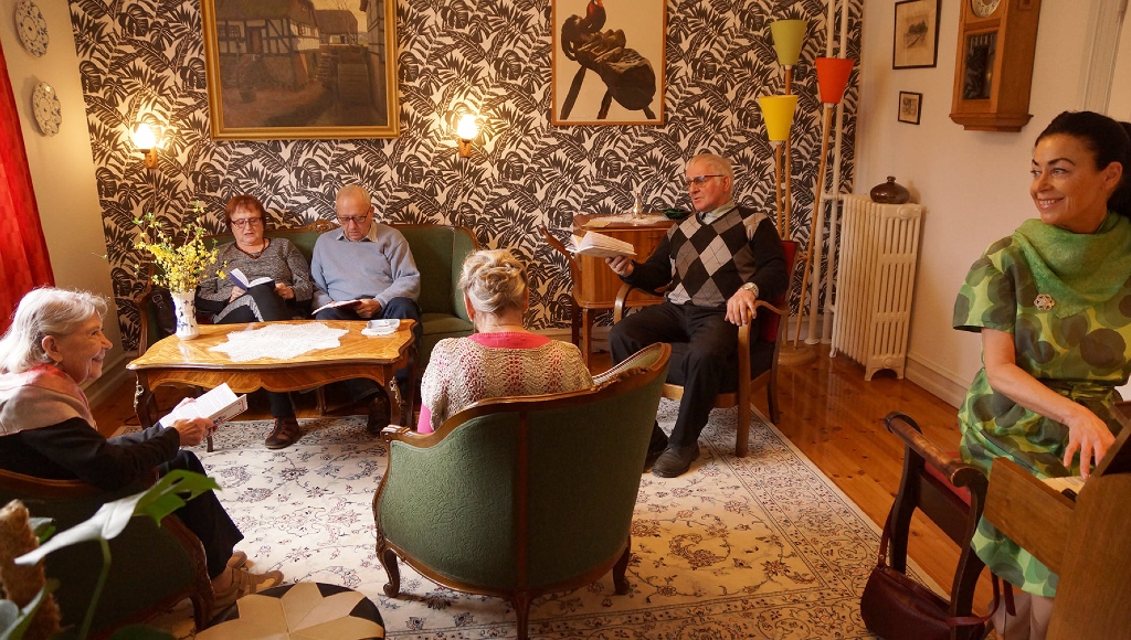 Gathering in a "memory apartment" in one of the houses in Den Gamle By in Aarhus, Denmark.
